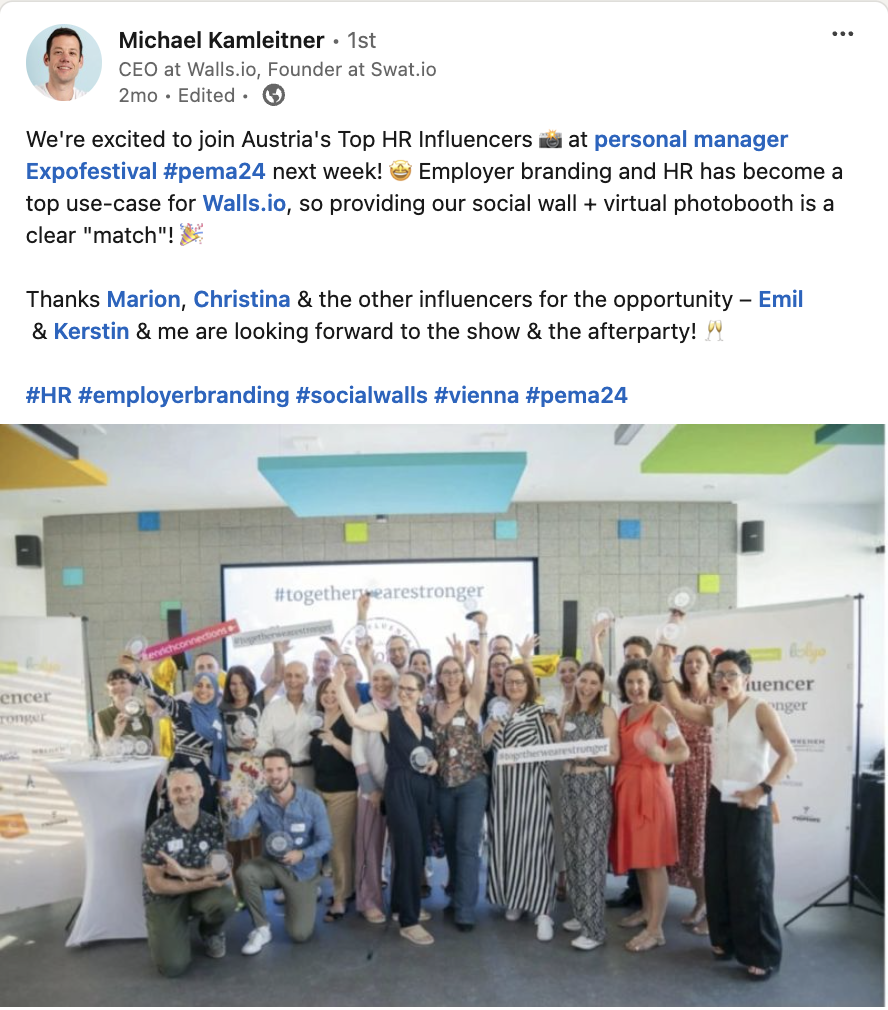 This image shows a LinkedIn post by Michael Kamleitner, CEO of Walls.io, celebrating an event promotion collaboration with Austria's top HR influencers at the Personal Manager Expo Festival, featuring a group photo of smiling attendees in front of a branded backdrop.