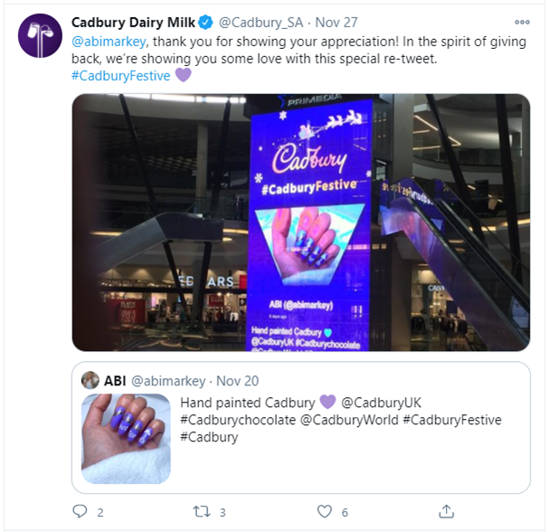 Screenshot of a tweet showing a contributor's photo of a nails decorated Cadbury-style on a big screen. (ugc campaign)