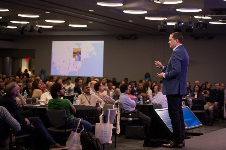 Cisco CEO Chuck Robbins standing in front of crowd in San Jose California during Cisco Leader Day.