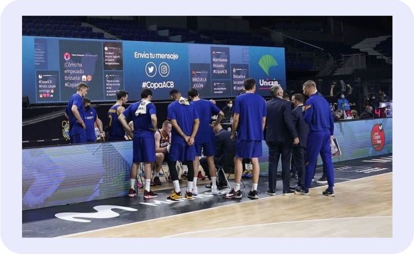 A social wall at La Copa del Rey basketball championship, displaying fan posts and event updates during a live game. (event marketing examples)