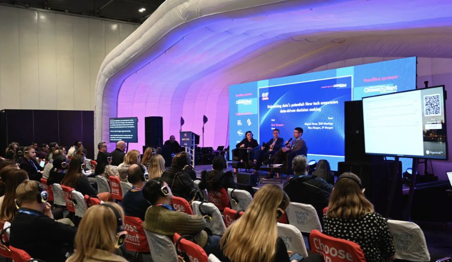 Presentation during Event Tech Live, showing colorful lighting in a specific area, as an example of how important lights are for a social photo booth.