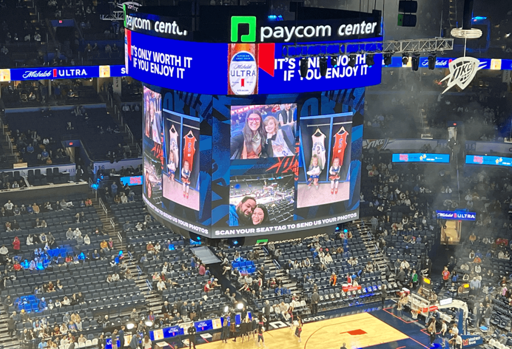 Jumbotron displaying a social wall suring an OKC game.